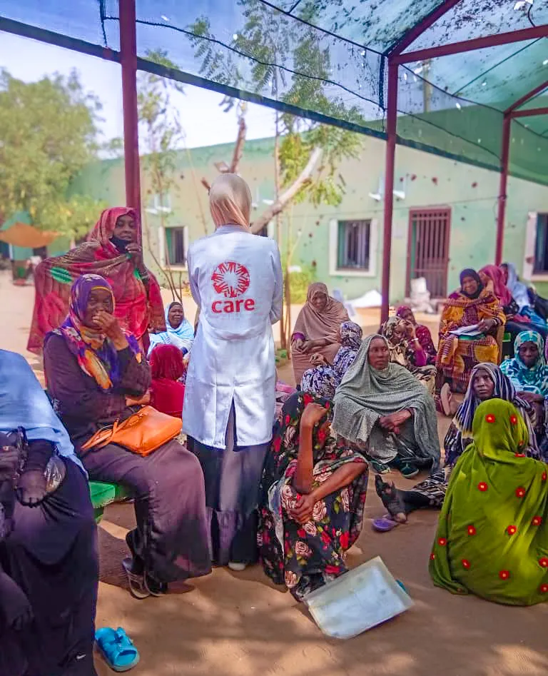 A group of internally displaced Sudanese women receiving health services at CARE’s mobile clinic.