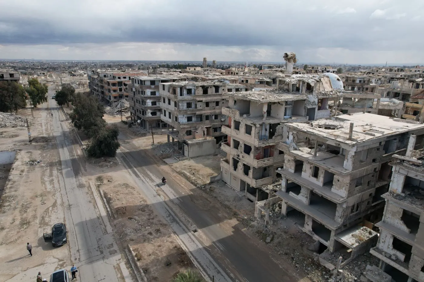 Rows of empty, windowless apartment buildings stretch into the distance, resembling a ghost town.