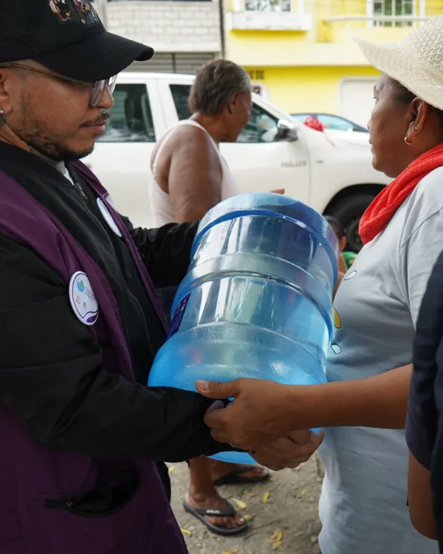 A CARE partner helps distribute clean water after an oil spill in Ecuador in 20205.